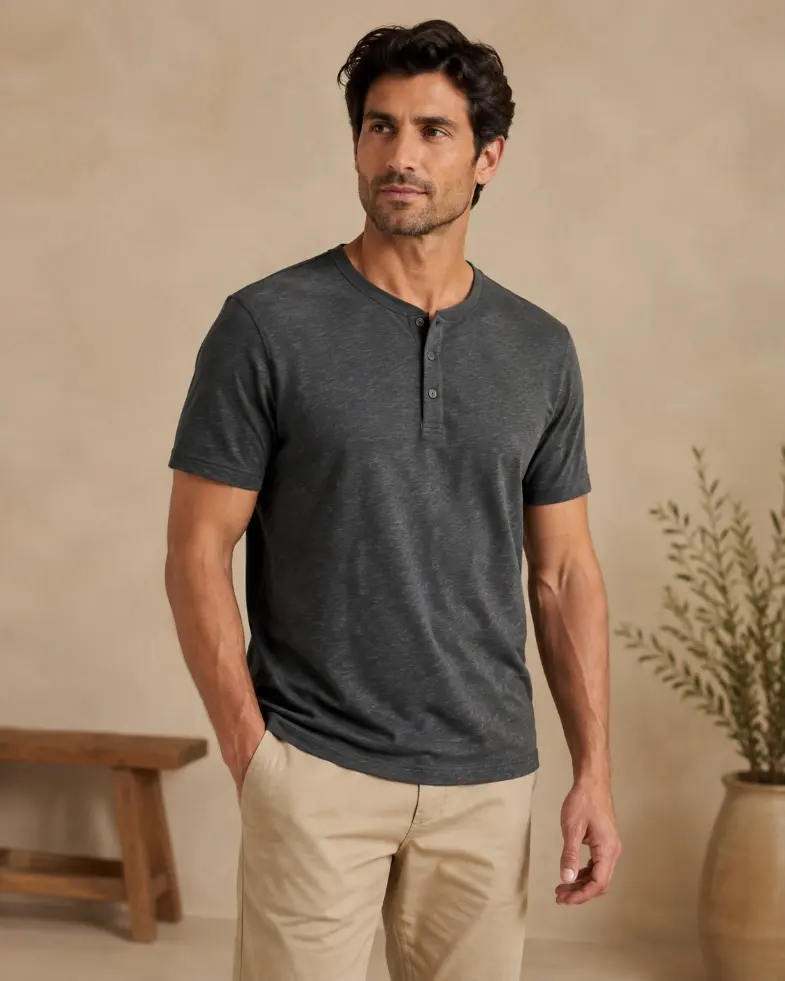 Model wearing a charcoal Henley T-shirt with a three-button placket