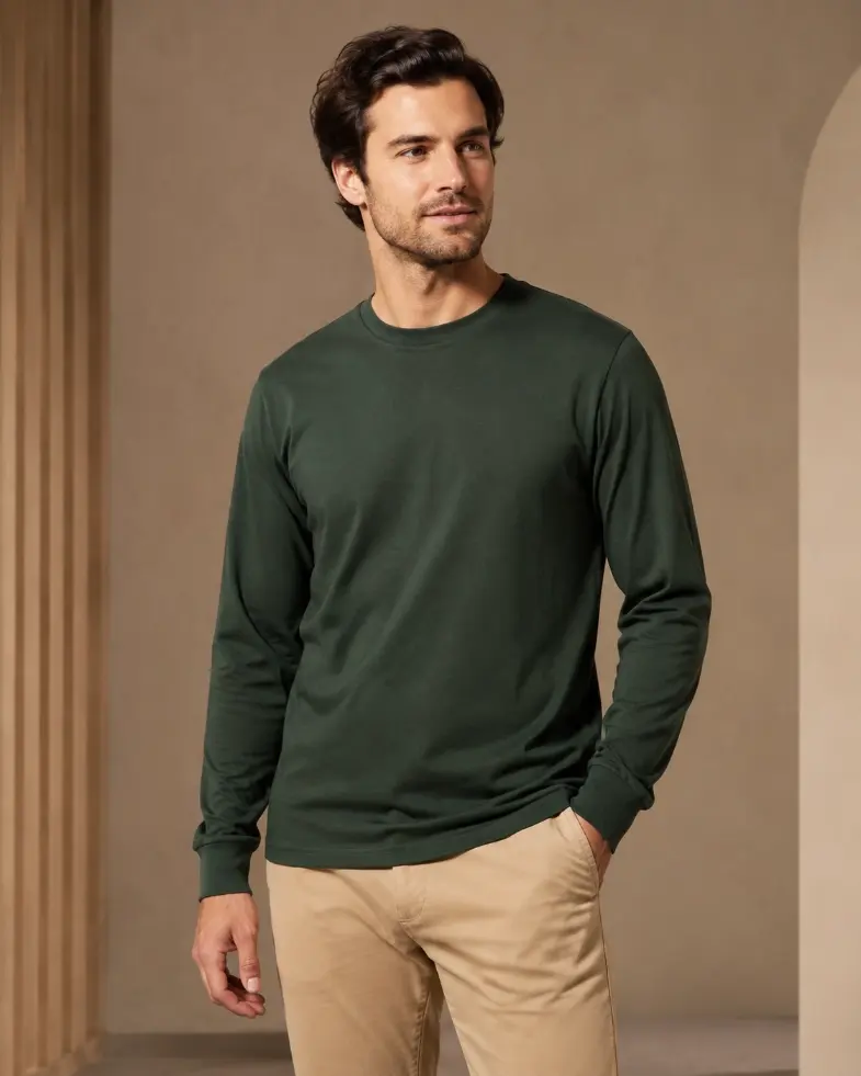 Model wearing a forest green long-sleeve T-shirt with wrist-length sleeves